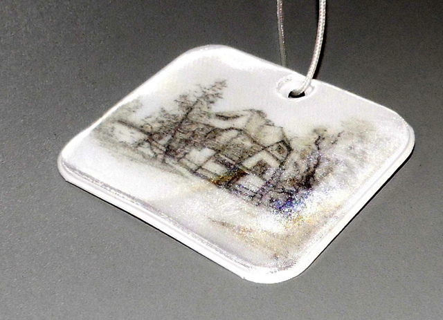 Heijastin talon logolla Heijastin talon logolla