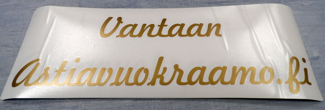 Kultainen tarra läpinäkyvällä siirtokalvolla Kultainen tarra läpinäkyvällä siirtokalvolla